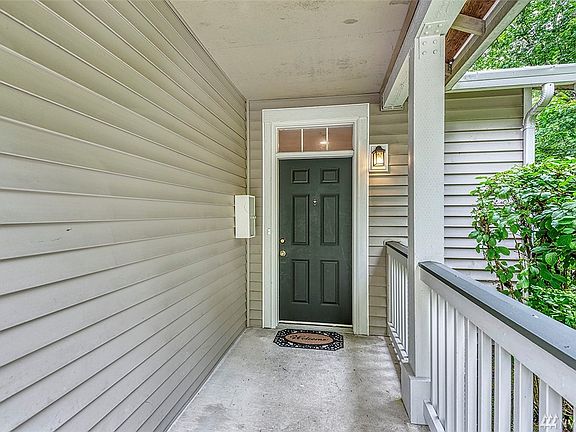This long, covered porch welcomes you in.