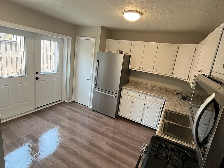 Kitchen has brand-new doors that open to front patio