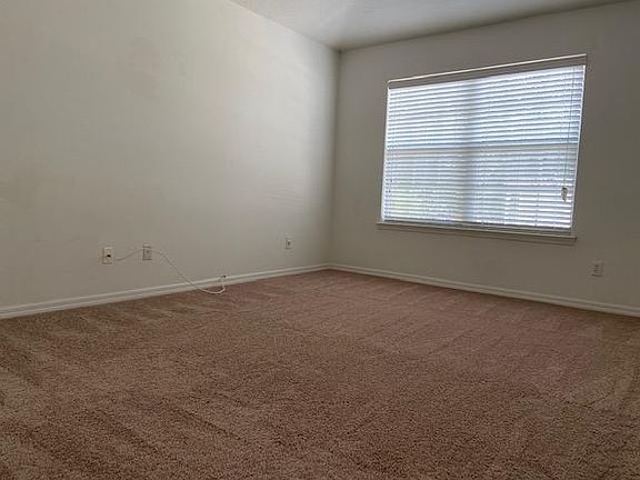 Spacious master bedroom has vaulted ceiling and plenty of light.