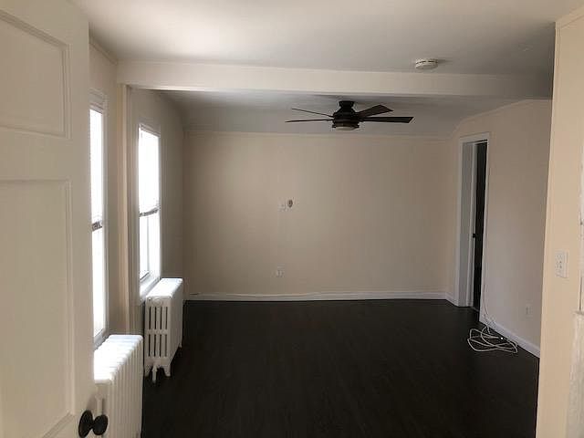 Living Room: door leads to small office/storage area