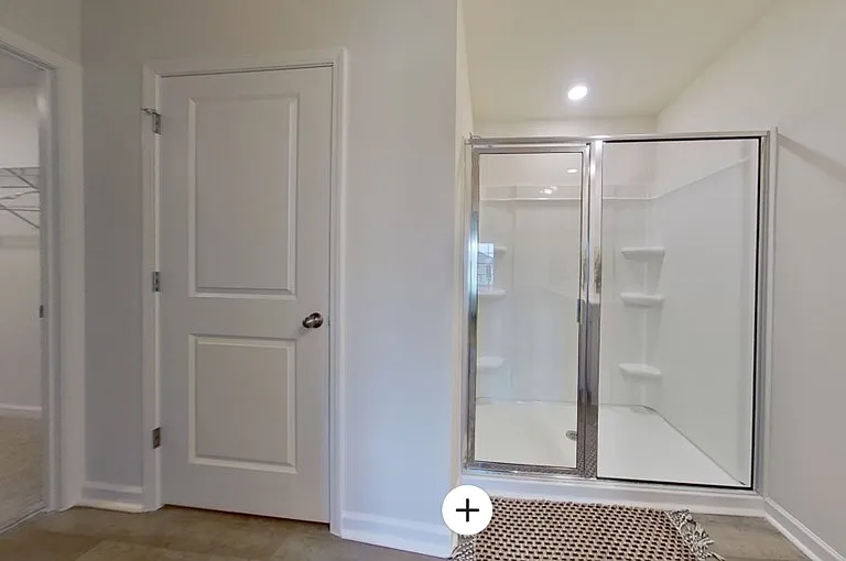Shower in primary with entry to walk-in closet and second closet