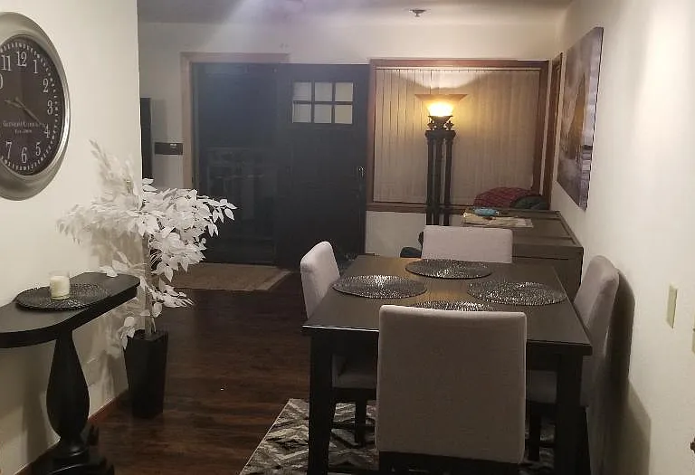 Dining room with door out to driveway / carport.