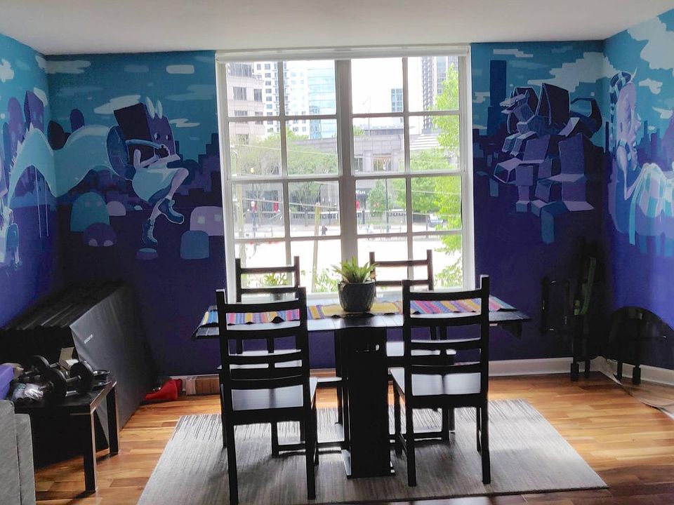 Den/dining area with unique, custom mural