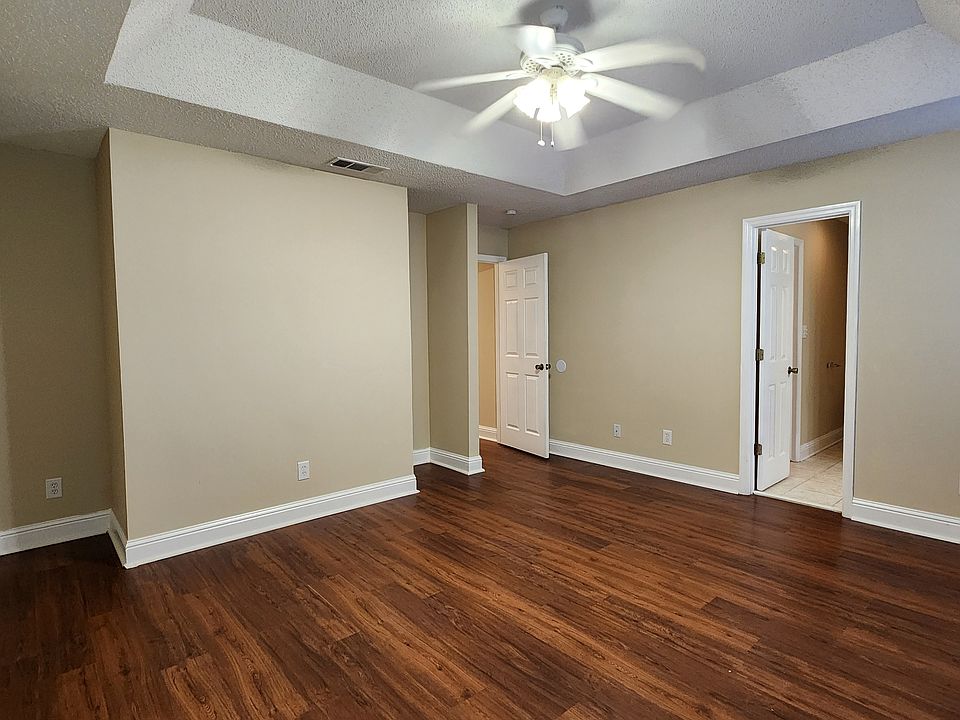 Primary bedroom with tray ceiling