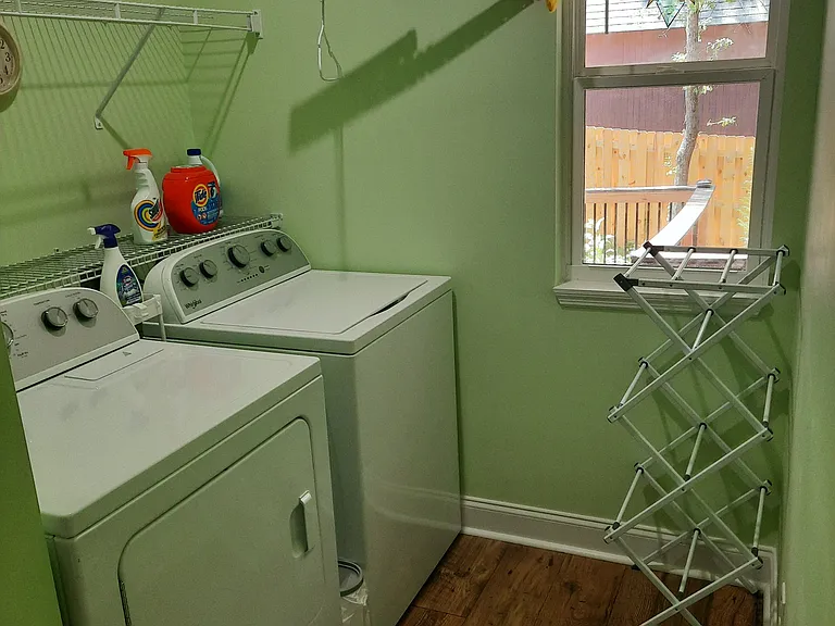 Laundry room with washer and dryer. Brand new machines.