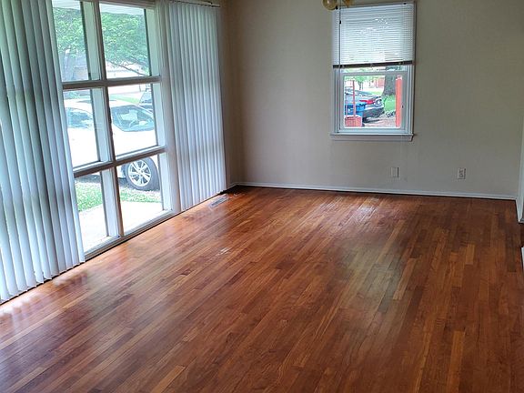 Large living room with wood floors.