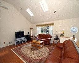 Large Living Room w/Hardwood Floors, Vaulted Ceiling and Skylights