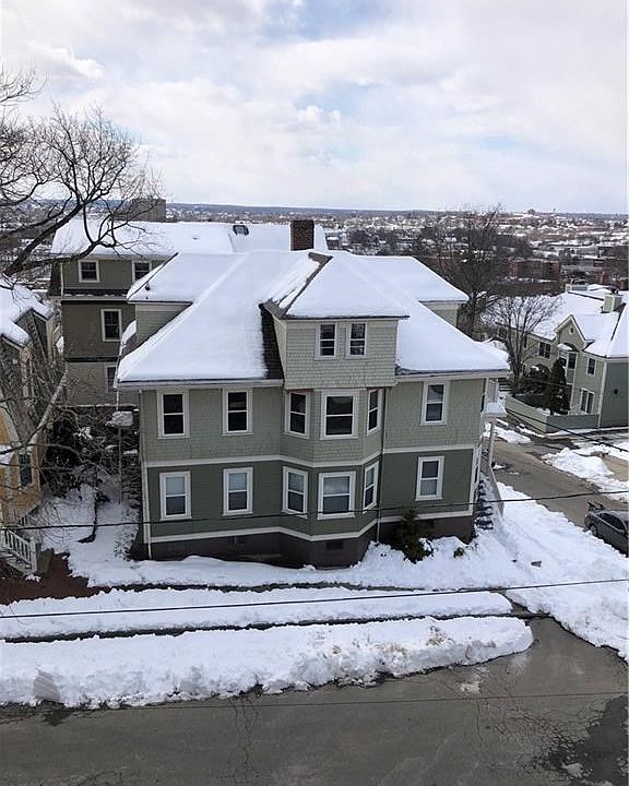 Aerial view of the condominium from the neighbors Third floor window.  Great shot of this property and views.  You will have the most beautiful sunsets while sitting on your front porch.