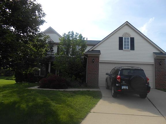 Exterior view of home with attached garage