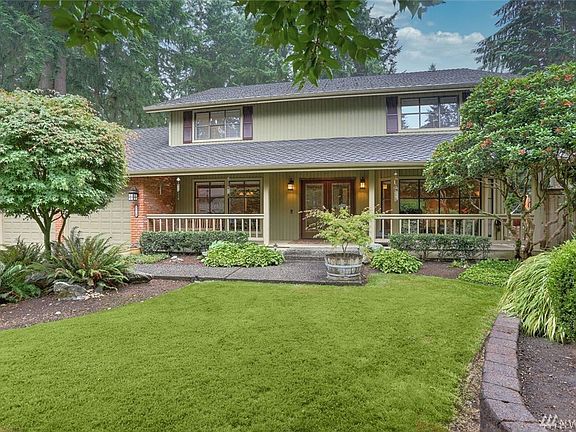 Newer Presidential, 50 yr roof & large, covered front porch surrounded by mature landscaping.
