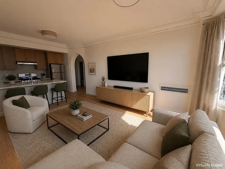 Living Room facing kitchen (virtually staged using AI)
