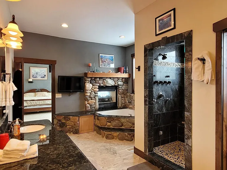 Spacious Master Bath, Make Up Counter, Sunken Jetted Tub, Steamer Shower, Dual Shower Heads.
