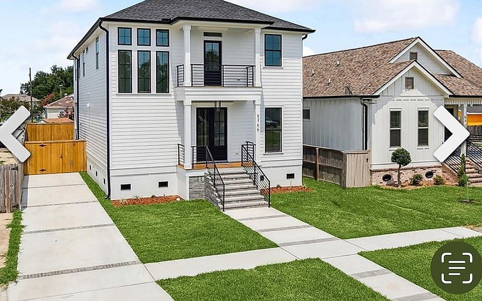 Two story home w/balcony.