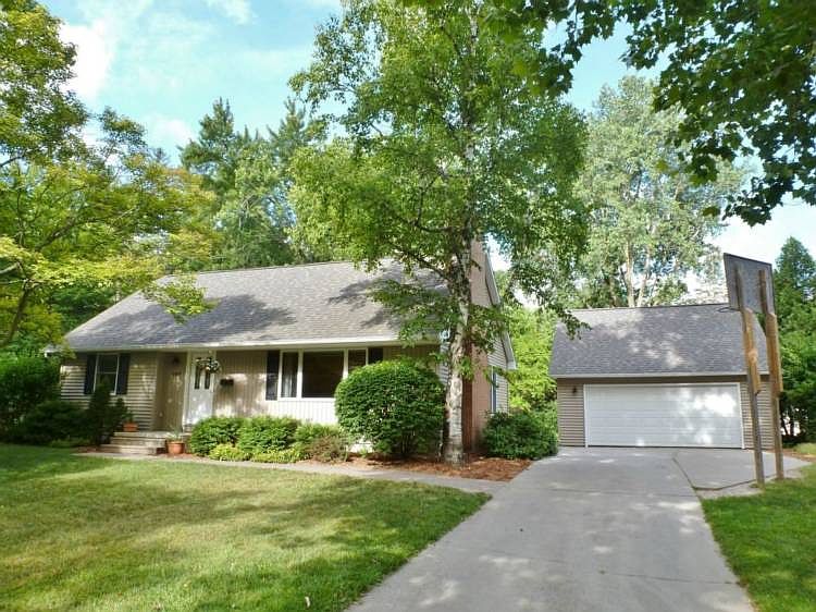 WONDERFUL 1.5 story home in the Plymouth area is loaded with charm!  Features newly refinished hardwood floors throughout entire house, 2 fireplaces, 4 bedrooms, 2 full bathrooms, spacious living room that is open to the dining room, kitchen with pass-through to dining room, large backyard with deck and patio, 2 car detached garage, roof 2008, attic fan, low utilities, newly refurbished brick chimney!  Lovely house with excellent curb appeal!