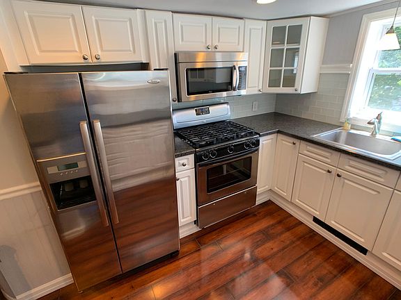 Kitchen with raised countertops and stainless steel appliances