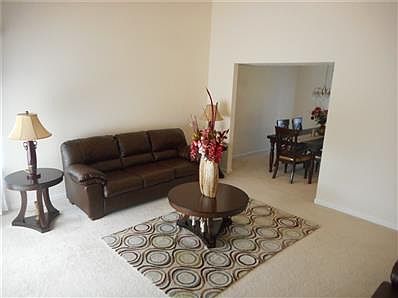 Spacious Great Room with Cathedral Ceiling leading into the formal dining room!