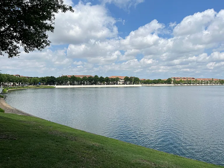 Neighborhood lake with walking paths.