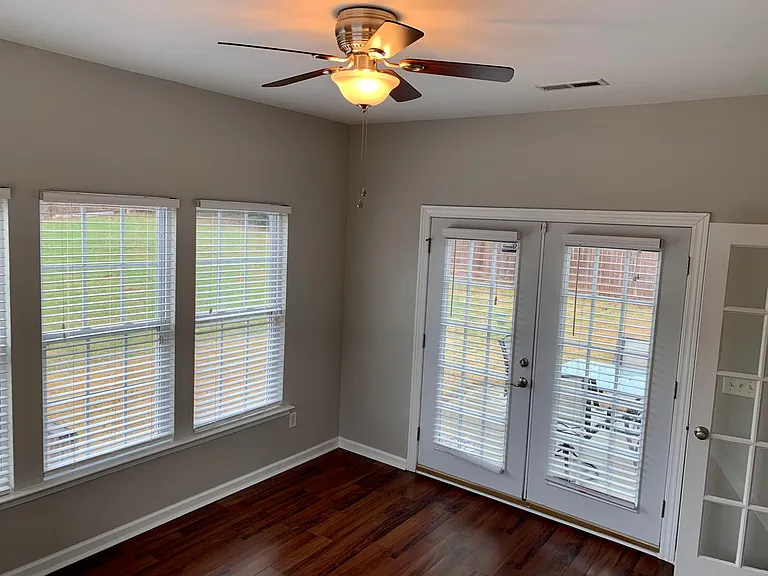 Sunroom/4th Bedroom with French door opening out to fenced in back yard and concrete patio.....