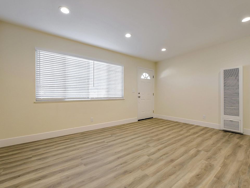 Remodeled living area with all new distressed laminate flooring & LED recessed lighting package