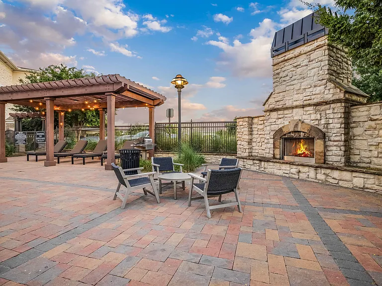 Poolside Fireplace with Cozy Seating
