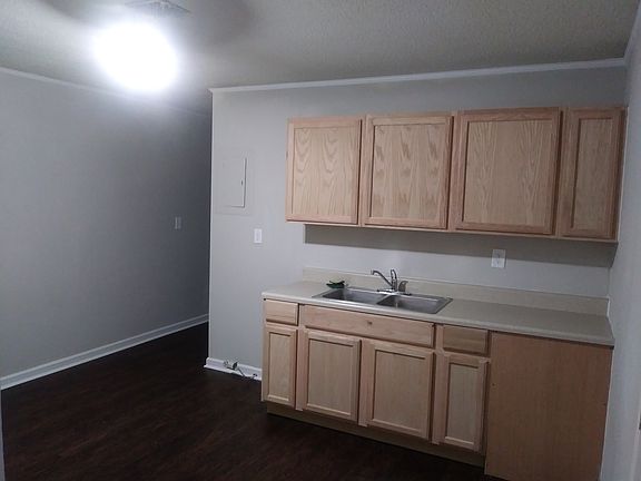 not pictured, but kitchen does include stove and fridge provided by landlord.