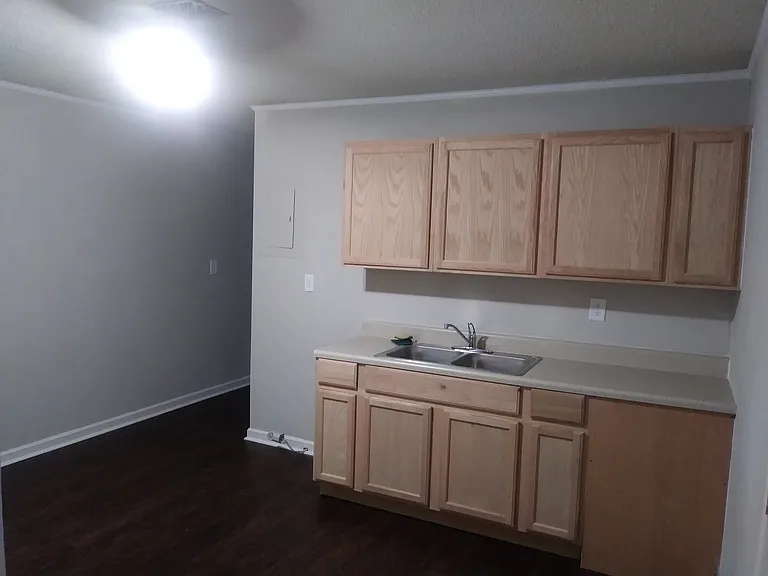 not pictured, but kitchen does include stove and fridge provided by landlord.