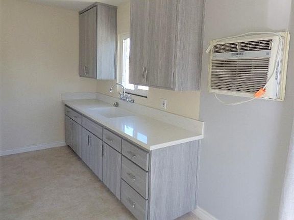 Upgraded cabinets, counter tops, Kitchen also has a gas stove, wall A/Cwill cool 720 sqft unit with fans t circulate air.