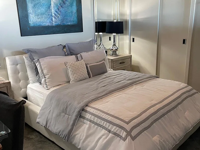 Bedroom with 2 Double Closets and dresser.