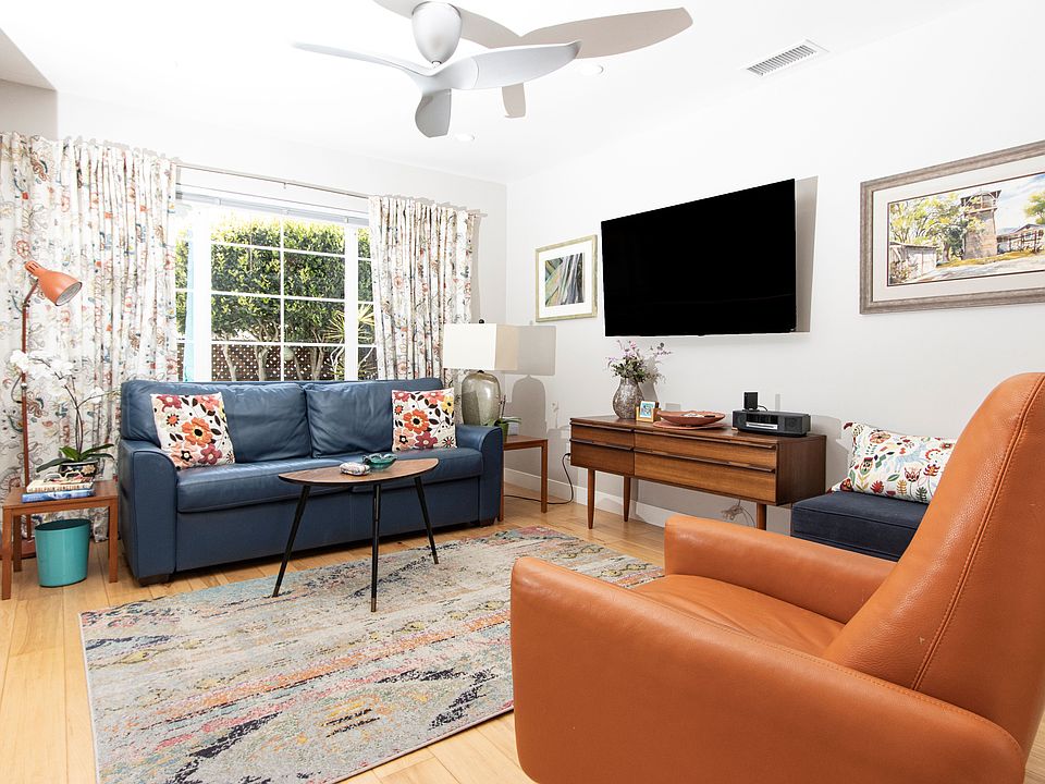 Flatscreen TV; Bose Wave Radio with bluetooth adapter. Ceiling fan, large window looks out to private patio.