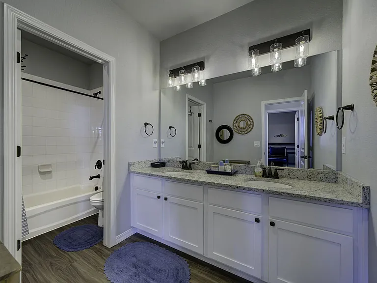 Full Bathroom
Upstairs hall bathroom with dual vanity and shower-tub combo