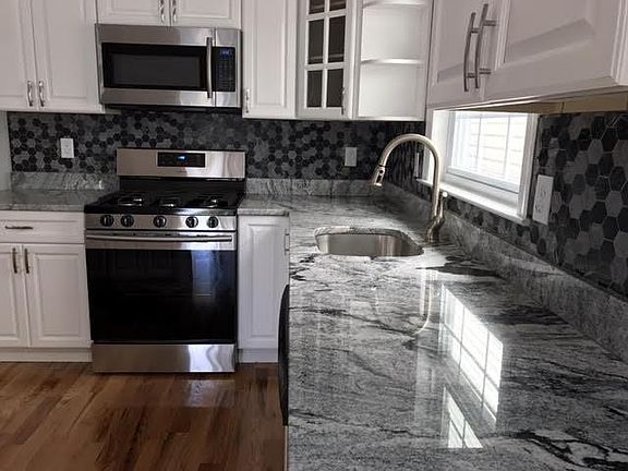 Granite counter tops - all stainless steel appliances, including dishwasher.