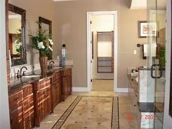 Jetted tub with dual walk-in closets