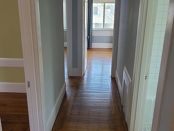 Hallway, lot's of natural light and beautiful wood floors