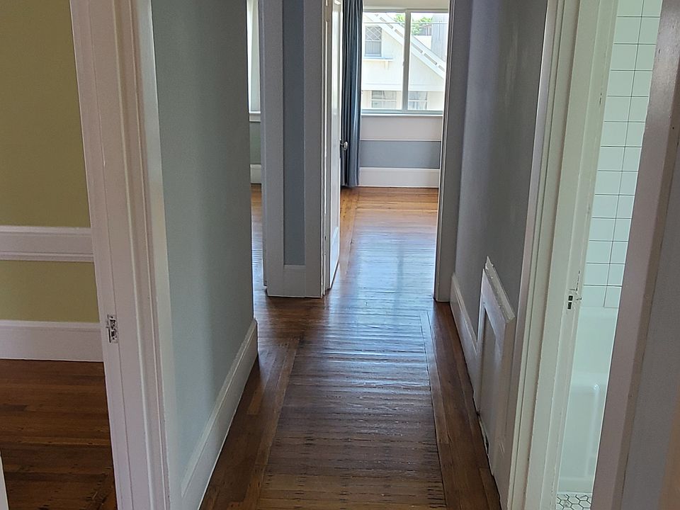 Hallway, lot's of natural light and beautiful wood floors