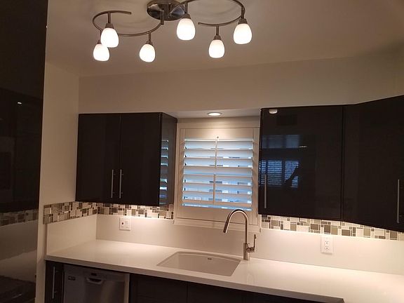 Ikea kitchen cabinets with undercounter lighting.