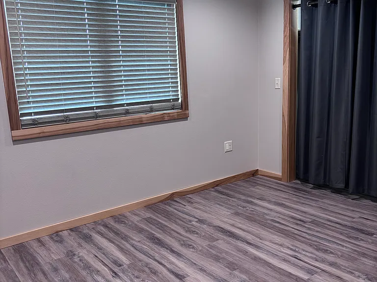 Double window in bedroom with blinds