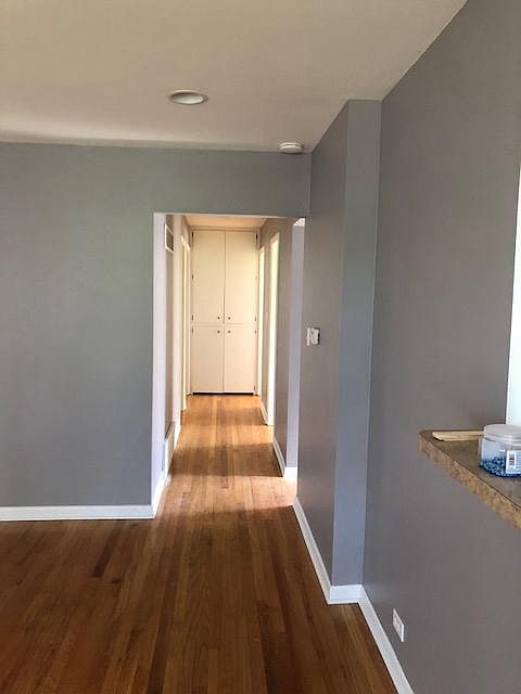 View from front door into hall way to 3 bedrooms and full ba