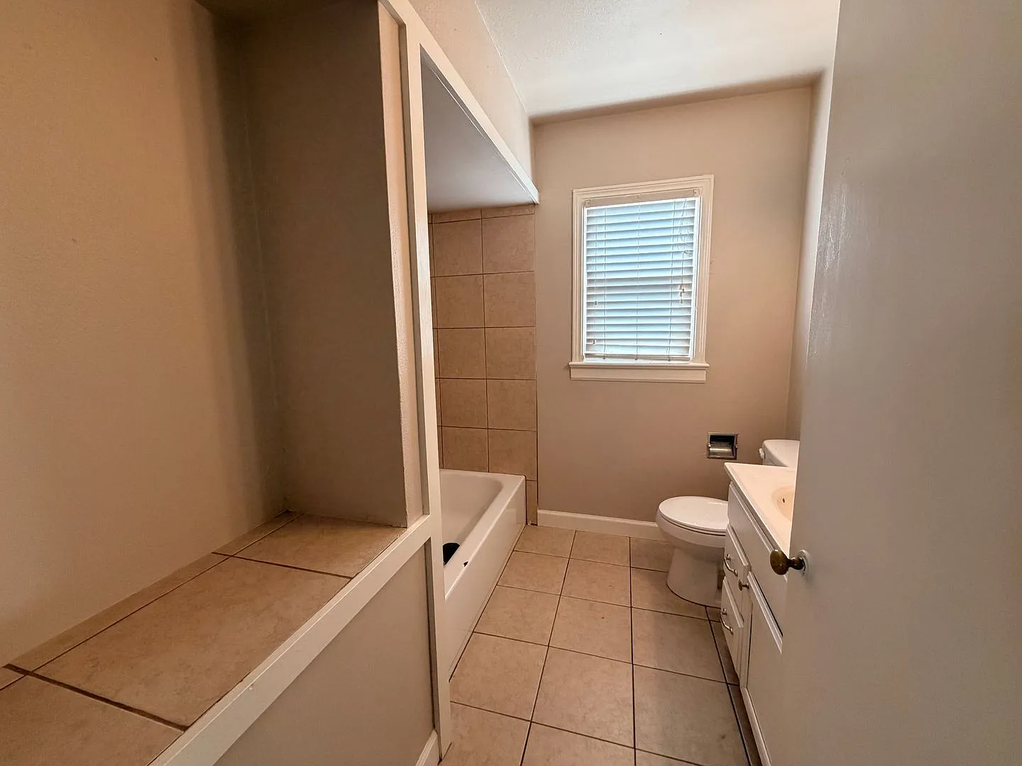 This two-bedroom, one-bath home in Russellville, AR — Photo 3