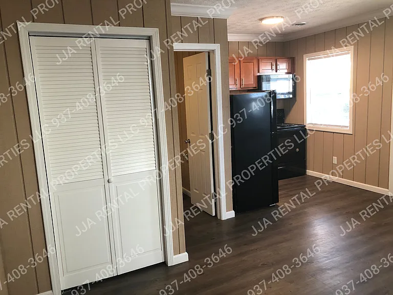 bedroom closet, bathroom door and kitchen