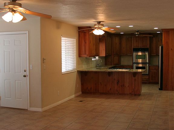 View of kitchen and dining area from family room