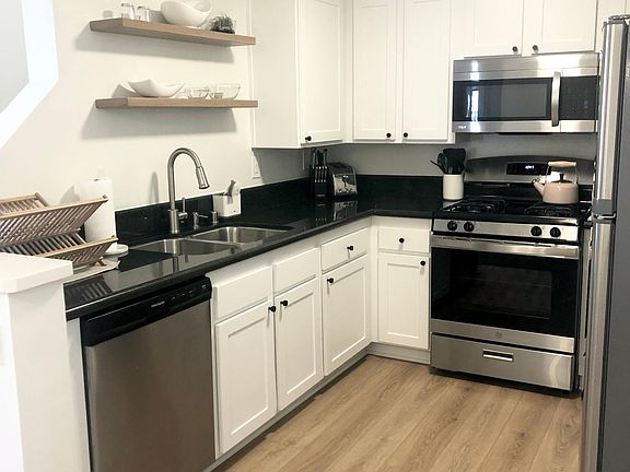 Kitchen with decorative open shelving
