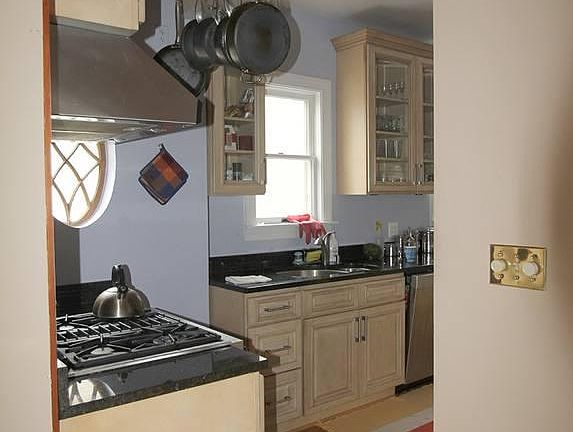 kitch open to main floor sun porch/tv room