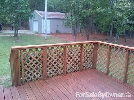View of detached garage from deck