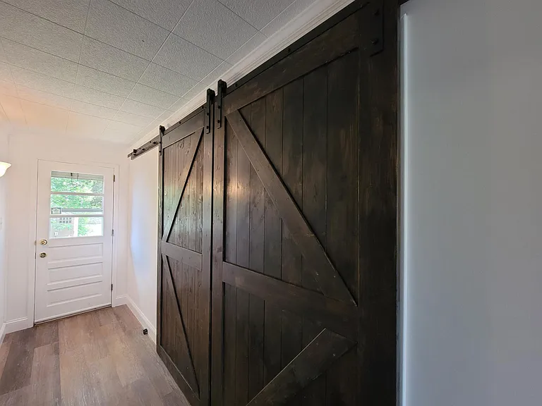 Barn doors leading to first floor bedroom/family room
