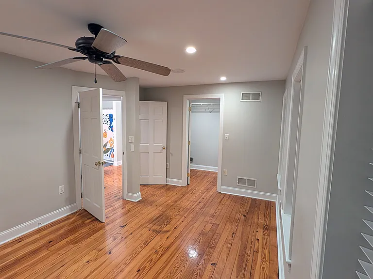 Looking toward the bathroon and walk-in closet in the master bedroom.