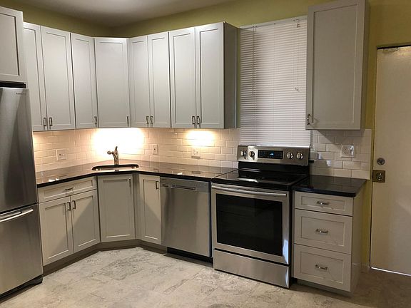 Stainless appliances, granite counter tops, flat-top stove & plenty of kitchen storage