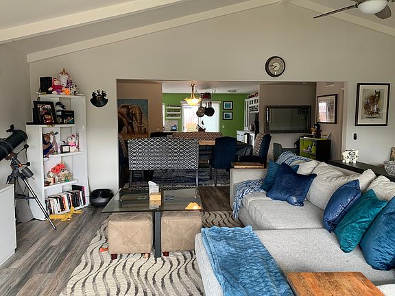 View from front window through the dining room to back of house.