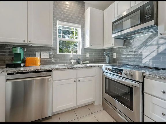 kitchen with ss appliances and granite tops