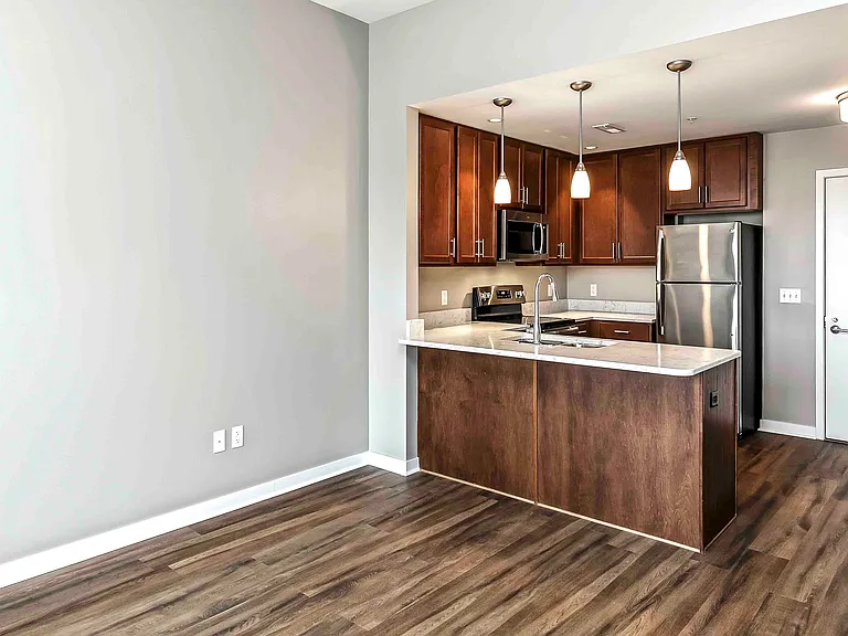 Warm wood cabinetry and sleek finishes make our kitchens both stylish and functional.