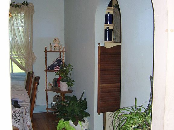 Arched doorways, hardwood floors, tons of personality.